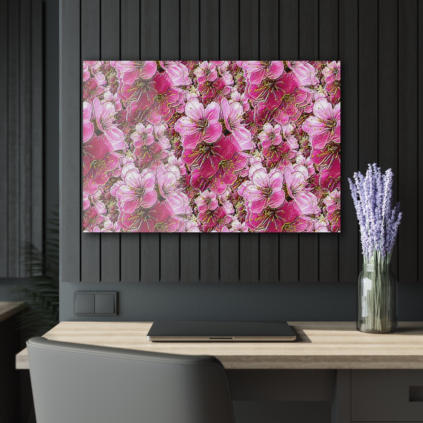 Landscape-oriented pink floral wall art above a wooden desk with a laptop and lavender in a dark, modern office.