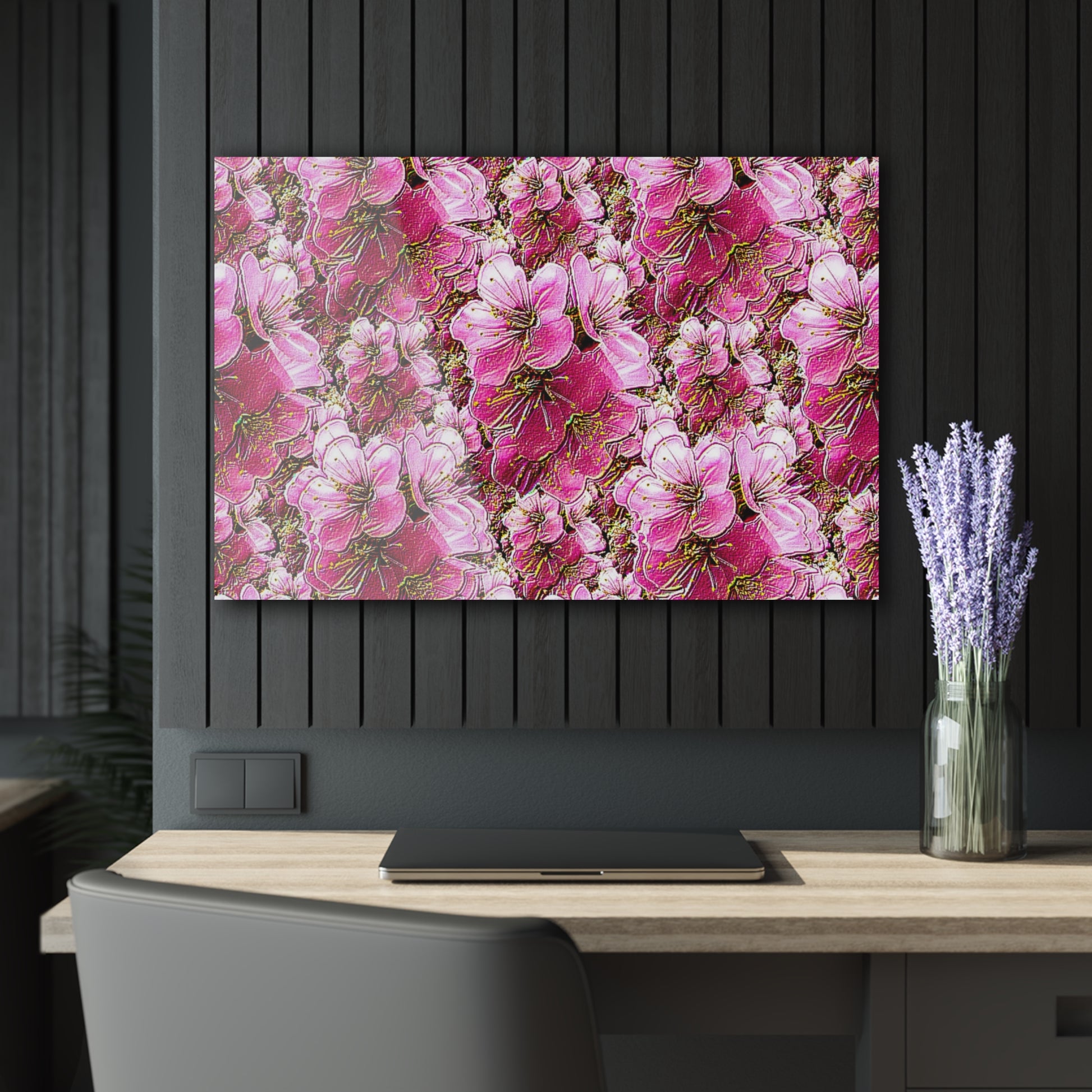 Landscape-oriented pink floral wall art above a wooden desk with a laptop and lavender in a dark, modern office.