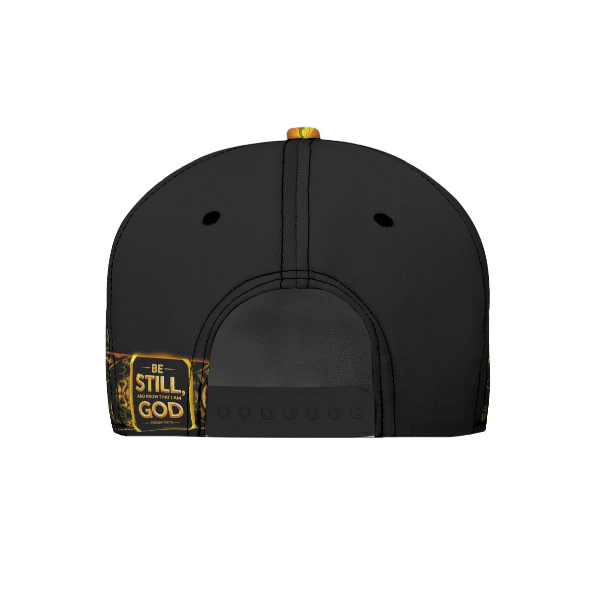 Back view of a black snapback hat with a small patch on the left side reading "Be Still, and know that I am God — Psalm 46:10" in gold text.