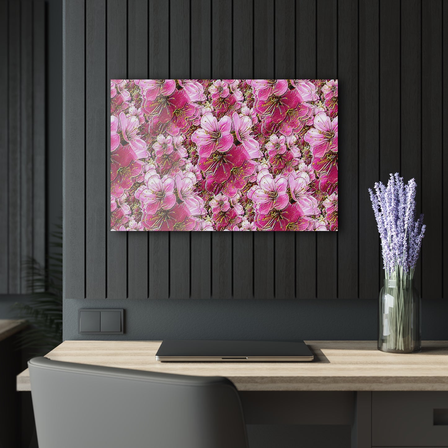 Floral painting on a black wall above a desk with a vase of lavender.