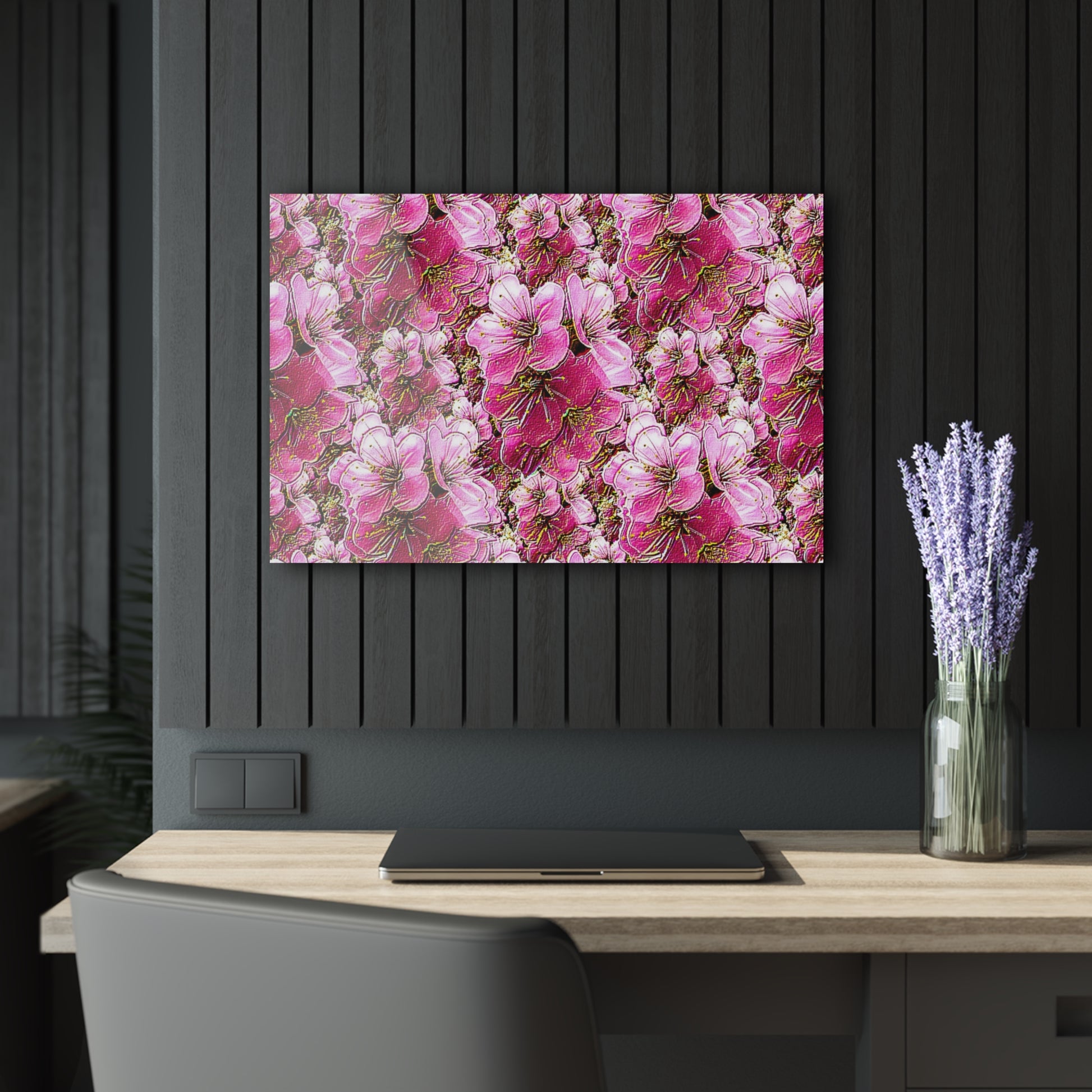 Floral painting on a black wall above a desk with a vase of lavender.