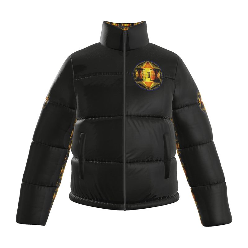 A front-facing view of the TimeReproofPortraits 'Royal Radiance' puffer jacket in black. The jacket features a high-collar and a circular geometric 'HEB' emblem in gold and amber on the left chest. The inner lining and side-arm panels showcase a matching golden mosaic pattern.