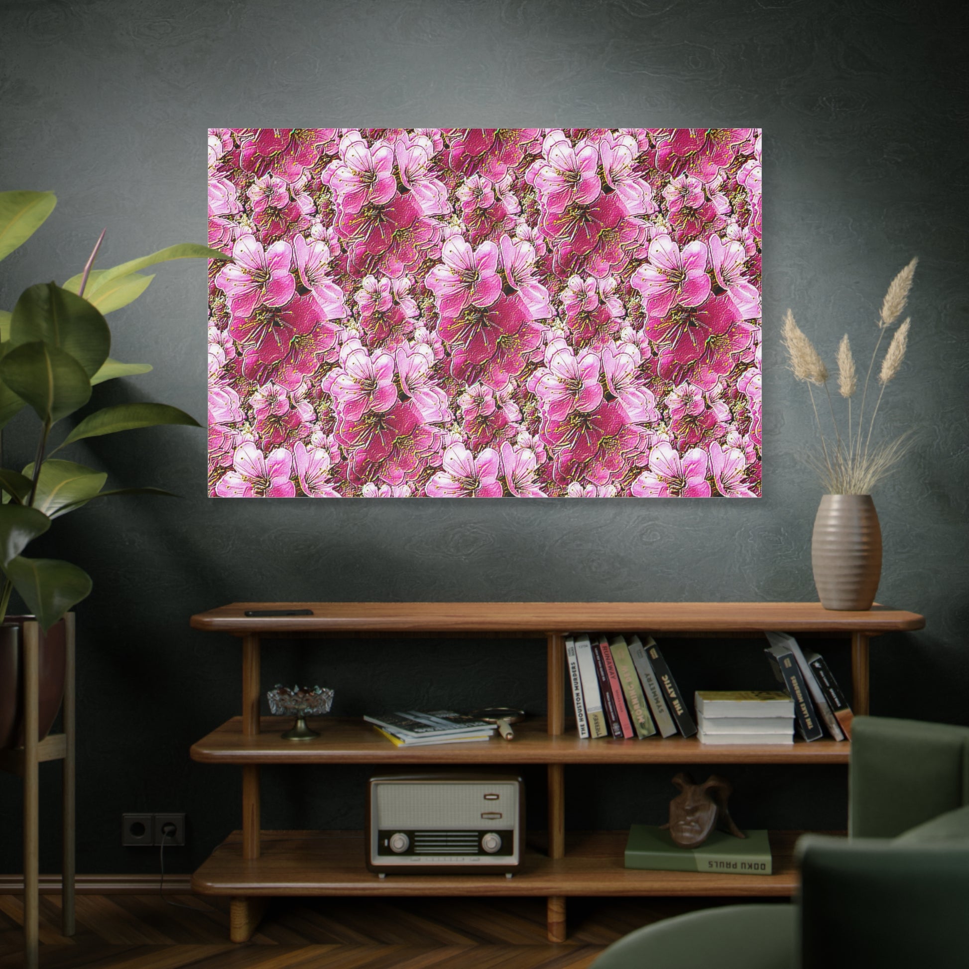 Vibrant pink and neon "Electric Flora" Sakura cherry blossoms on a stretched matte canvas, displayed on a dark wall above a mid-century wooden bookshelf.