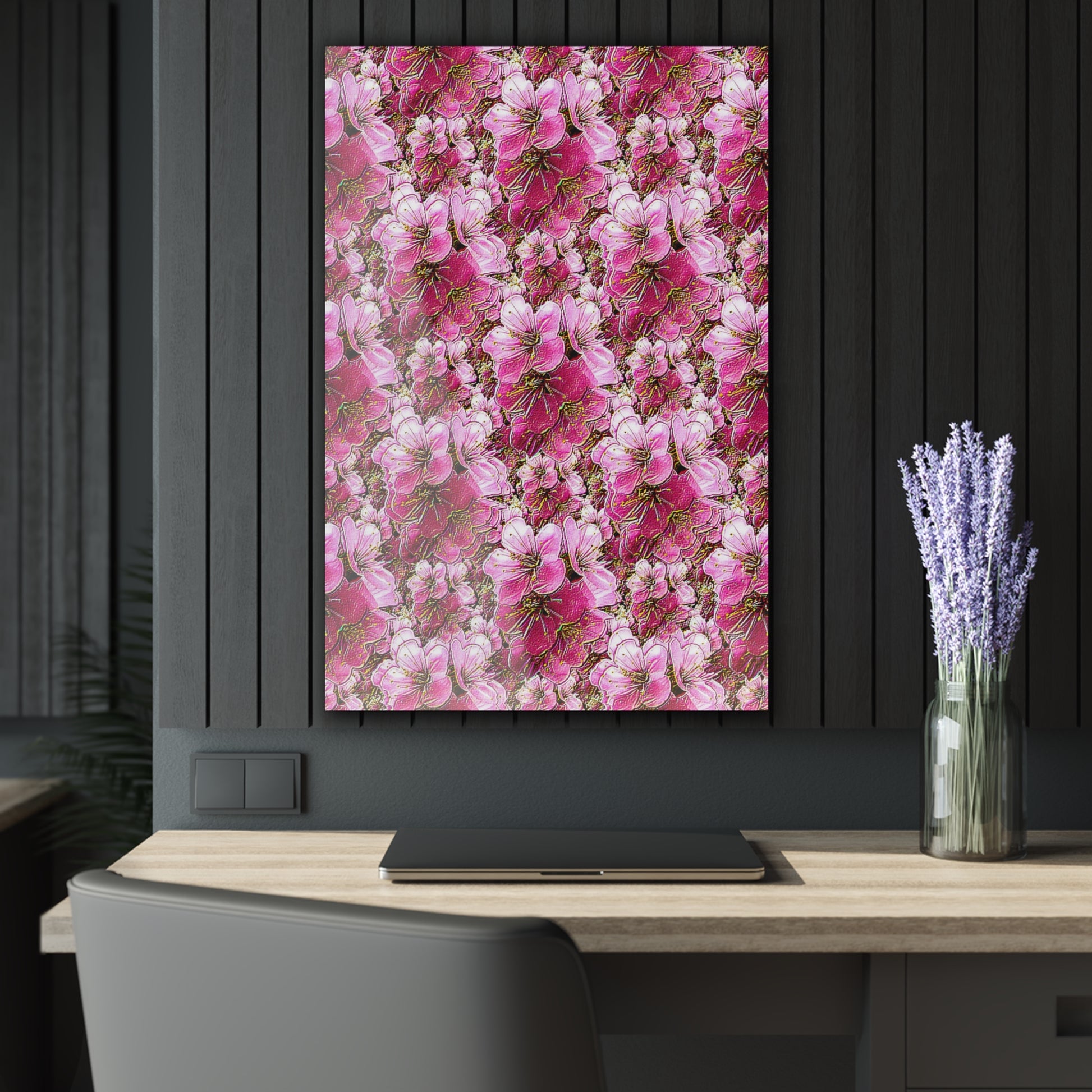 Portrait-oriented pink floral wall art above a wooden desk with a laptop and lavender in a dark, modern office.