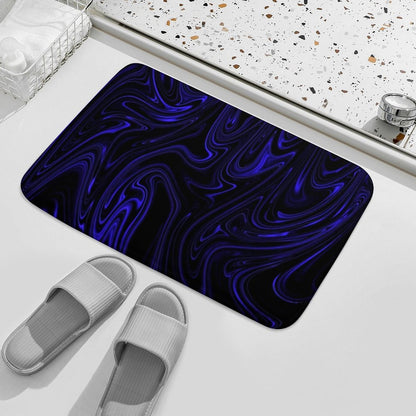 Overhead perspective of the Flow (01-02) Cobalt bath rug. Showcases the full "Heavenly Depths" fluid pattern alongside neutral-toned spa slippers.
