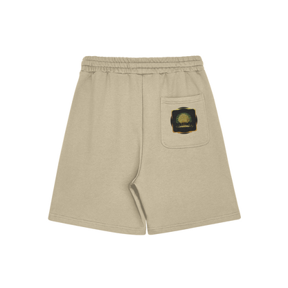 Back flat lay of beige-colored Yahuah: Tree of Life sweat shorts featuring a golden tree graphic on the back pocket.