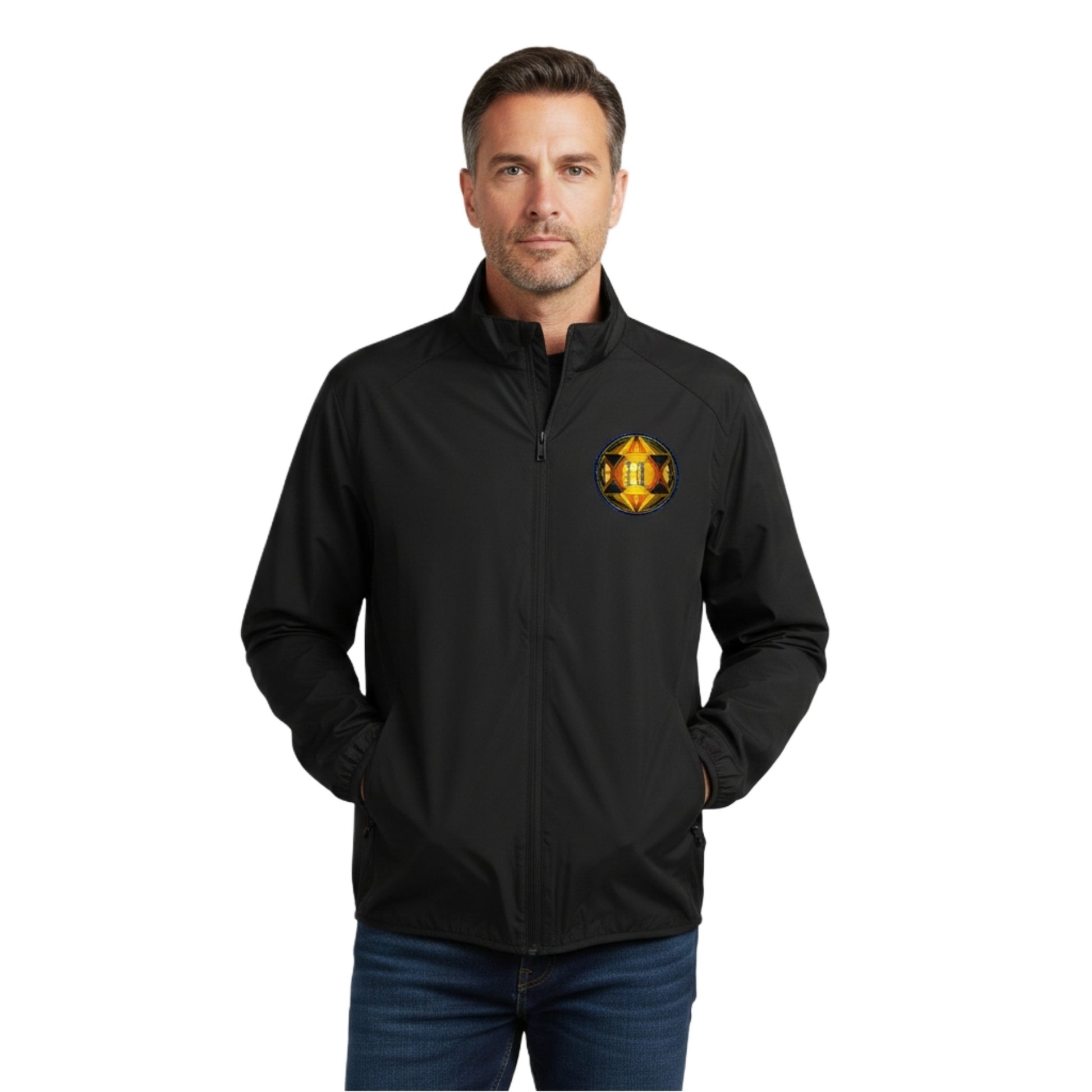 Front view of a man wearing a black zip-up jacket with a circular gold and orange geometric emblem on the left chest, isolated on a white background. 