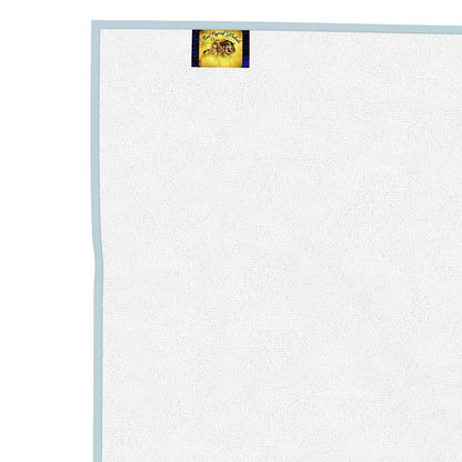 White towel with a TRP brand logo in the corner on a white background