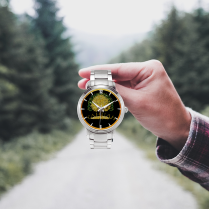 Yahuah: Tree of Life (03) automatic watch  in silver stainless steel, held by a hand in front of a forest road.