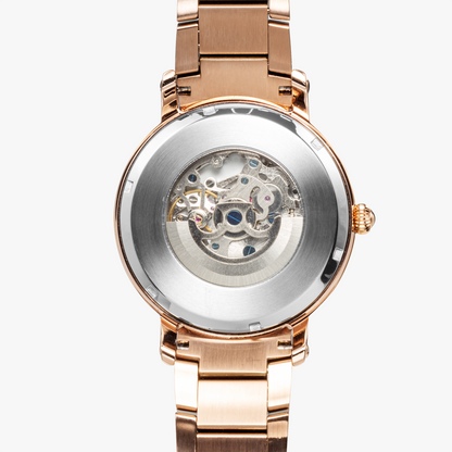 Yahuah: Tree of Life (03) automatic watch presented with rose gold stainless steel strap with a focus on the case and dial details with a white background.