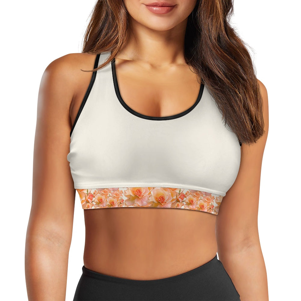 Apricot Blom Essential sports bra with black contrast piping and apricot floral pattern. 