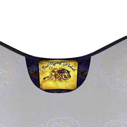 Close-up of the interior neck label of the Nocturnal Sanctuary dress, featuring a yellow graphic of a roaring lion and "Time Reproof Portraits" text.