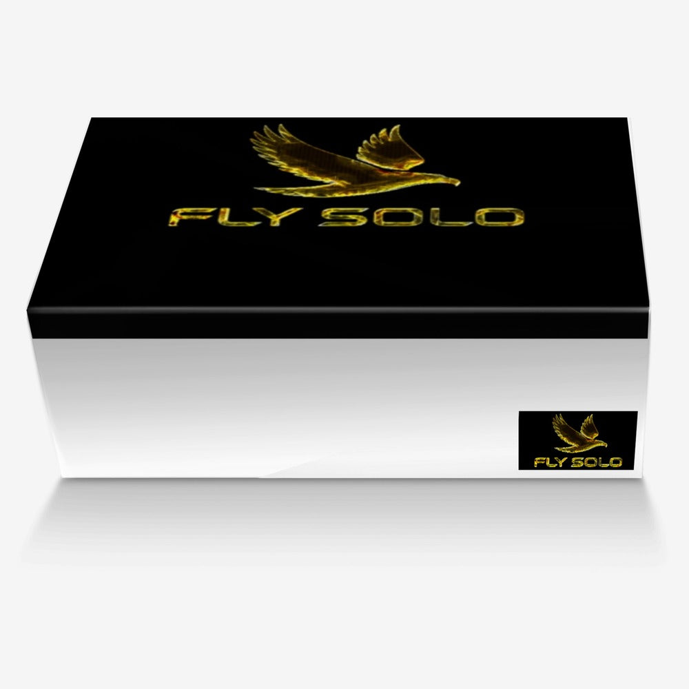 Shoebox top view with a central Fly Solo gold eagle logo, a dark cover, and a smaller branding sticker on the side panel, all in a black and white color scheme.