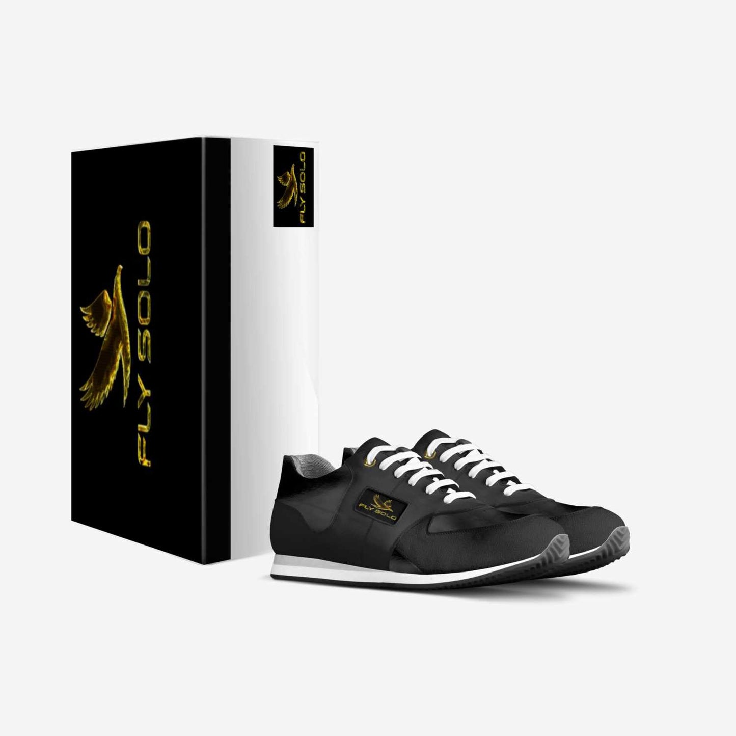 A pair of black and white men’s Fly Solo walking sneakers next to their custom black and gold designer shoe box.