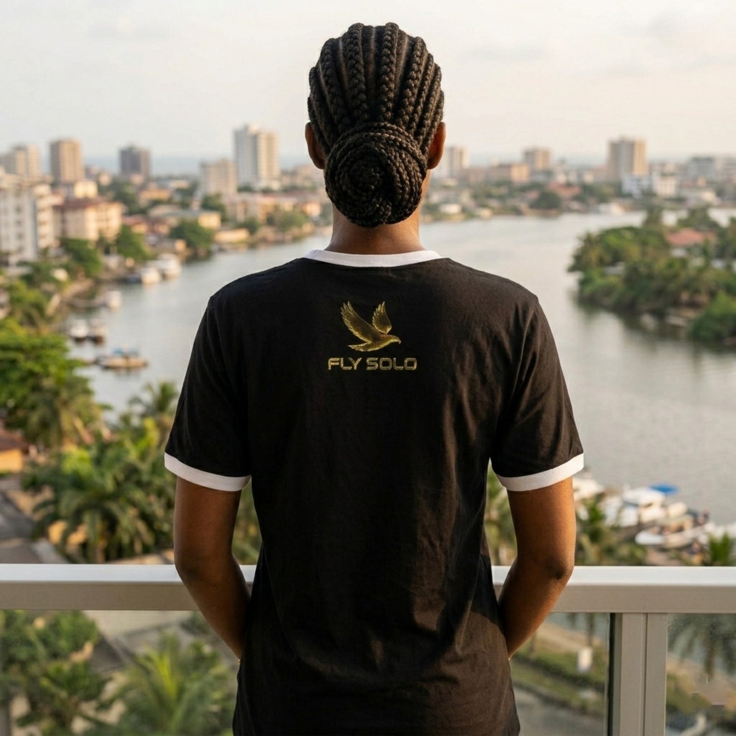 logo-view.jpg	Back view of the black Fly Solo ringer tee showing the gold eagle logo and brand name centered between the shoulders.