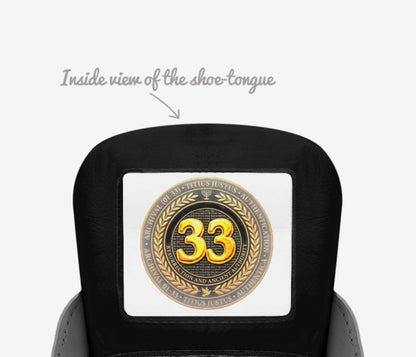 Inside view of the shoe tongue featuring a circular gold emblem with the number 33 and the text "Resurrection and Ancient Authority".