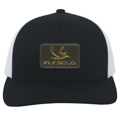 Clean front product shot of the navy  Fly Solo trucker hat with white mesh panels and gold embossed branding.