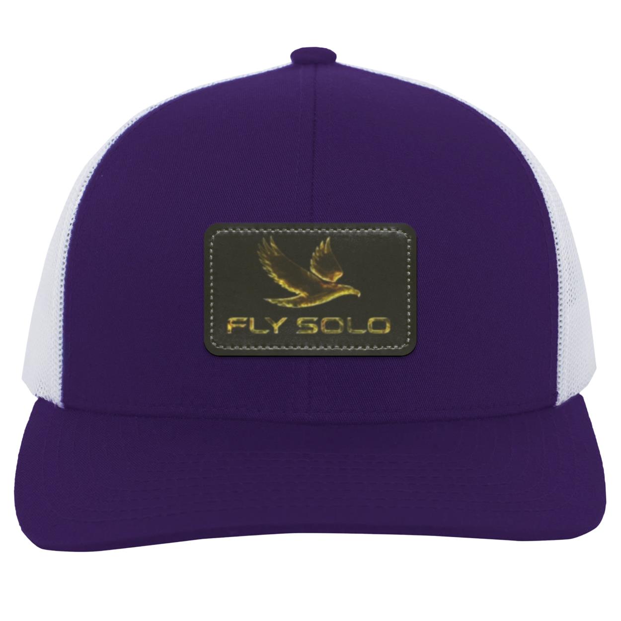 Front product shot of the deep purple Fly Solo trucker hat with white mesh panels and golden "Fly Solo" branding.