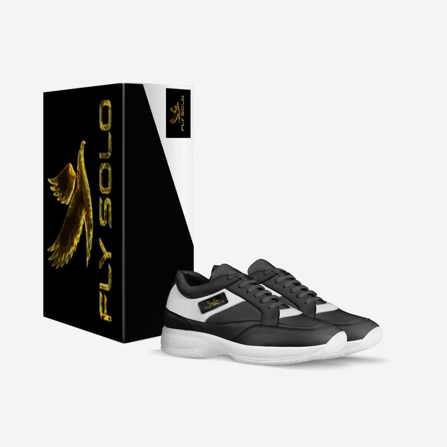 A pair of black and white women’s Fly Solo walking sneakers next to their custom black and gold designer shoe box.