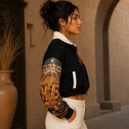 Profile view of a woman in the Hebrew World black cropped streetwear fleece bomber jacket, showing detailed right sleeve artwork.