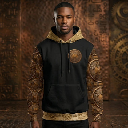 Front view of a Black man modeling the "I AM HEBREW" black and gold hoodie with patterned sleeves and a central circular "I AM" gold emblem.