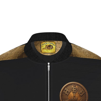 Close-up of black denim bomber jacket collar with gold lion portrait label, textured gold yokes, and back HEBREW I AM emblem.