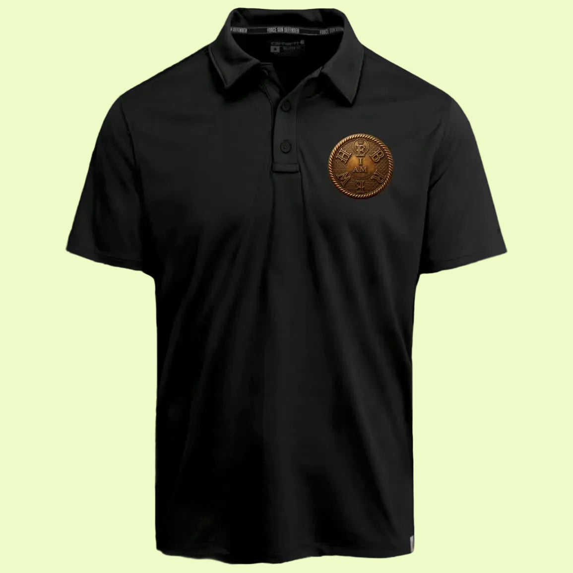 Studio shot of the front of the black adult "I AM HEBREW" Force Sun Defender polo shirt laid flat against a beige background, featuring the bronze circular logo.