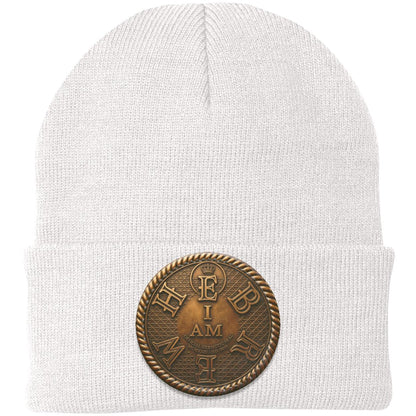 Product photo of the white I AM HEBREW knit beanie against a white background, highlighting the central leather patch with the "I AM HEBREW" design.