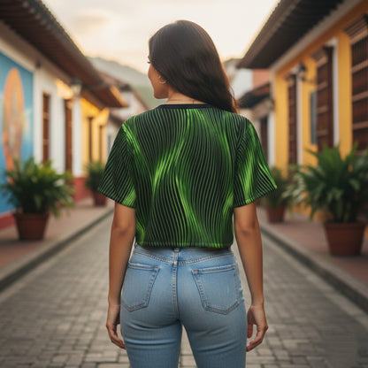 Back view of a woman in a green wavy-patterned crop top and blue jeans, standing on a cobblestone street lined with vibrant buildings.