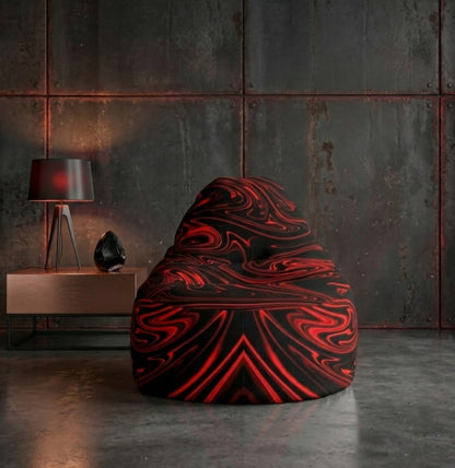 A bean bag with a red and black marble pattern sits in a dark, industrial room with rusted metal wall panels and a copper side table.