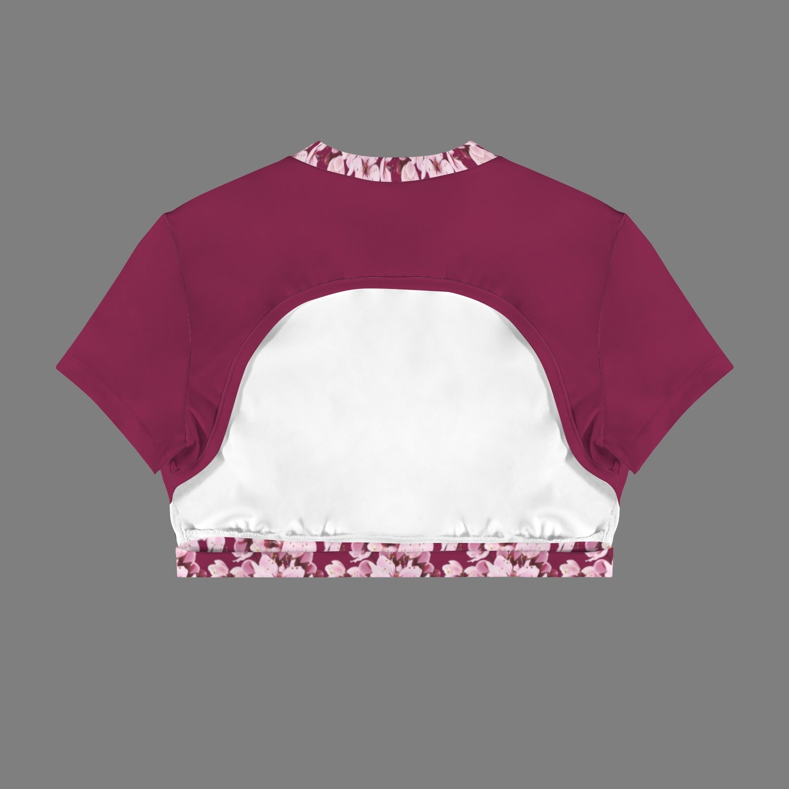 Product flat lay back view of the Sakura Symphony magenta crop top, displaying the dramatic crescent cutout and white inner lining.