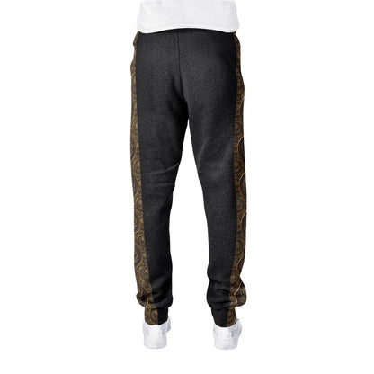 Isolated back view of dark charcoal cotton-blend joggers highlighting the seamless edge of the bronze patterned side panels and ribbed ankle cuffs.