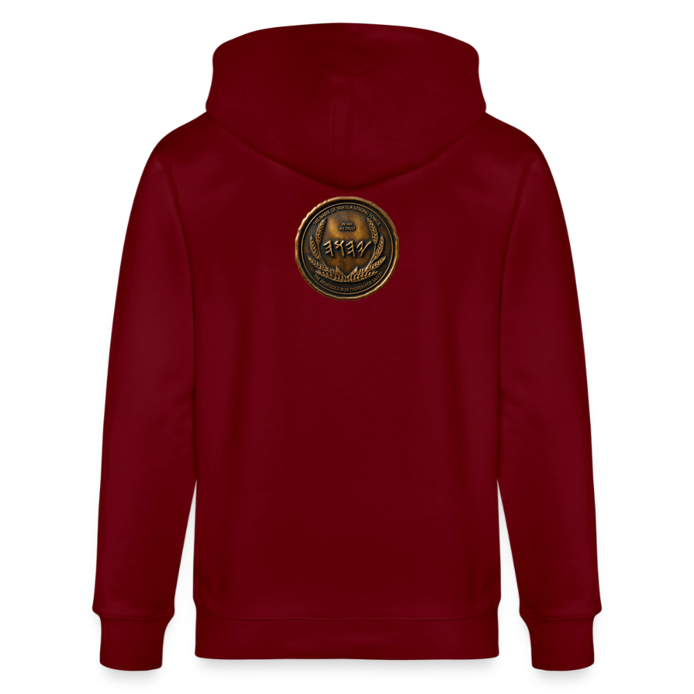 Back view of a burgundy organic zip hoodie featuring a large circular antiqued bronze medallion emblem centered on the upper back.