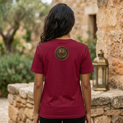 Back view of a burgundy oversized heavyweight t-shirt showing a detailed circular antiqued bronze emblem centered on the upper back.