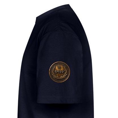 Side view showing the left sleeve of a navy blue oversized heavyweight t-shirt with a circular antiqued bronze Paleo-Hebrew medallion emblem.