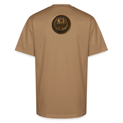 Back view of a tan oversized heavyweight t-shirt displaying a circular antiqued bronze Paleo-Hebrew medallion emblem centered on the upper back.