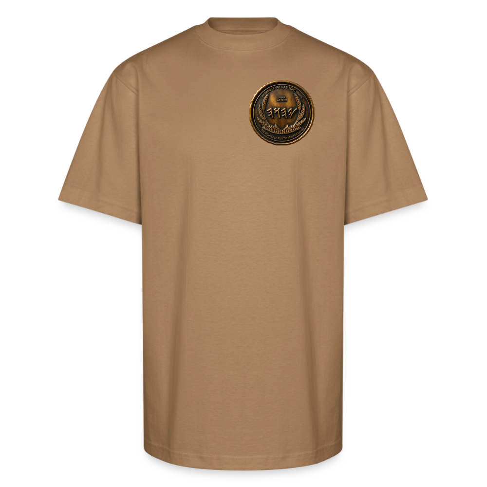Front view of a tan oversized heavyweight t-shirt featuring a circular antiqued bronze Paleo-Hebrew medallion graphic on the left chest.