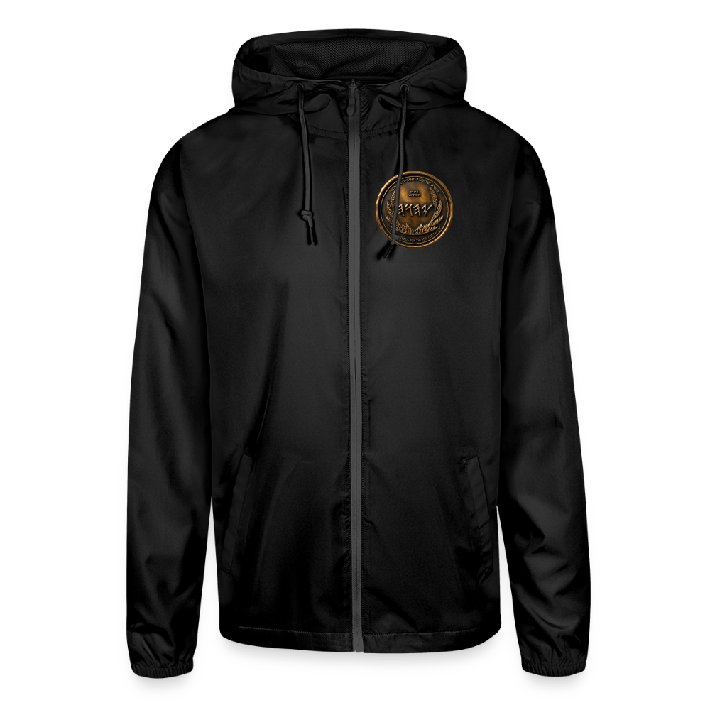 Front view of a black lightweight windbreaker with a circular antiqued bronze medallion emblem featuring Paleo-Hebrew script on the left chest.