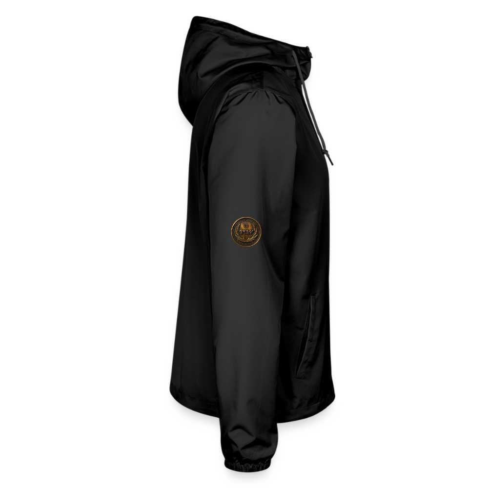 Right side profile view of a black lightweight windbreaker showcasing a small antiqued bronze Paleo-Hebrew medallion on the upper sleeve.