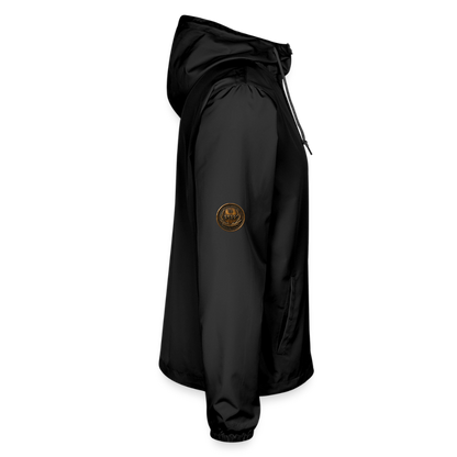 Right side profile view of a black lightweight windbreaker showcasing a small antiqued bronze Paleo-Hebrew medallion on the upper sleeve.