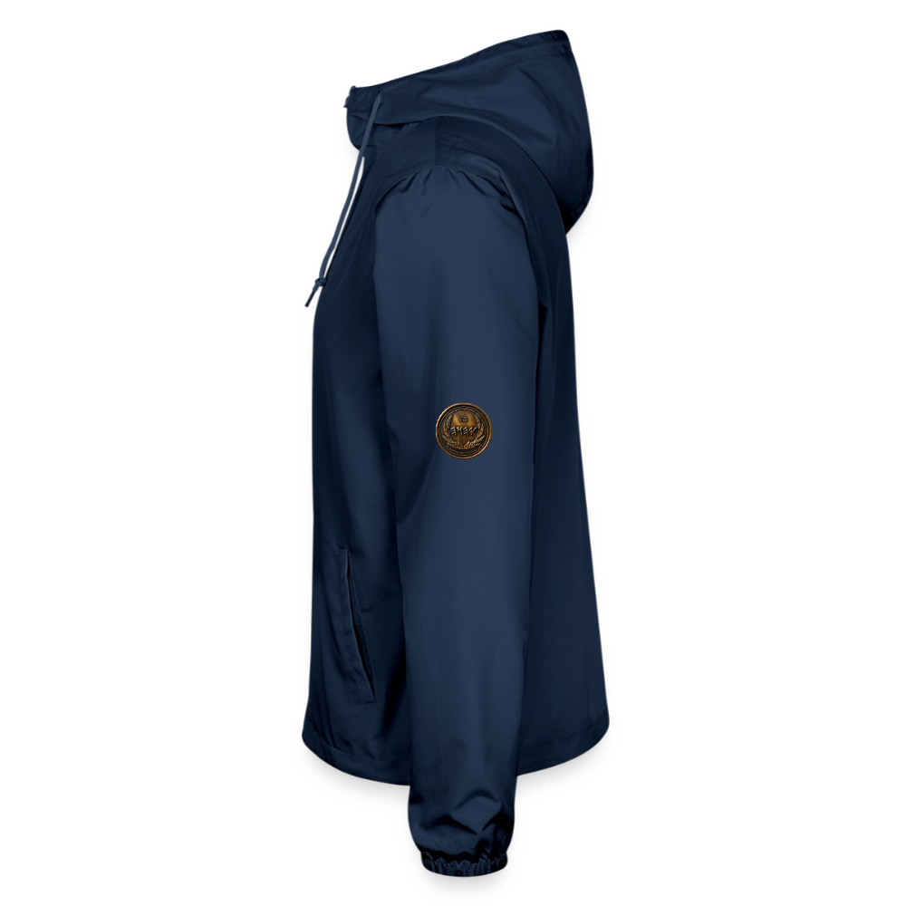 Left side profile view of a navy blue lightweight windbreaker with a circular antiqued bronze Paleo-Hebrew script medallion on the upper sleeve.