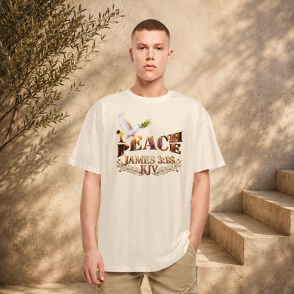 A man wearing the sand-colored Teach Peace unisex heavyweight oversized t-shirt next to outdoor stone stairs.
