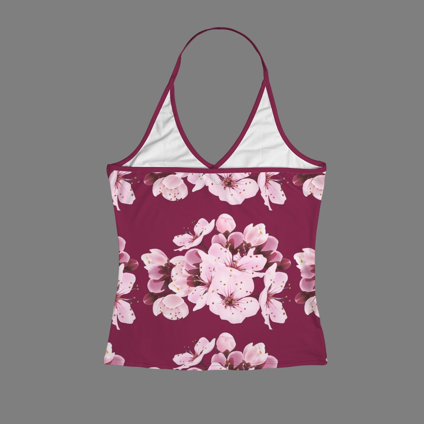 Rear flat lay view of the Sakura Symphony halter v-neck cami top showcasing the thin strap construction and vibrant pink floral print on a maroon base.