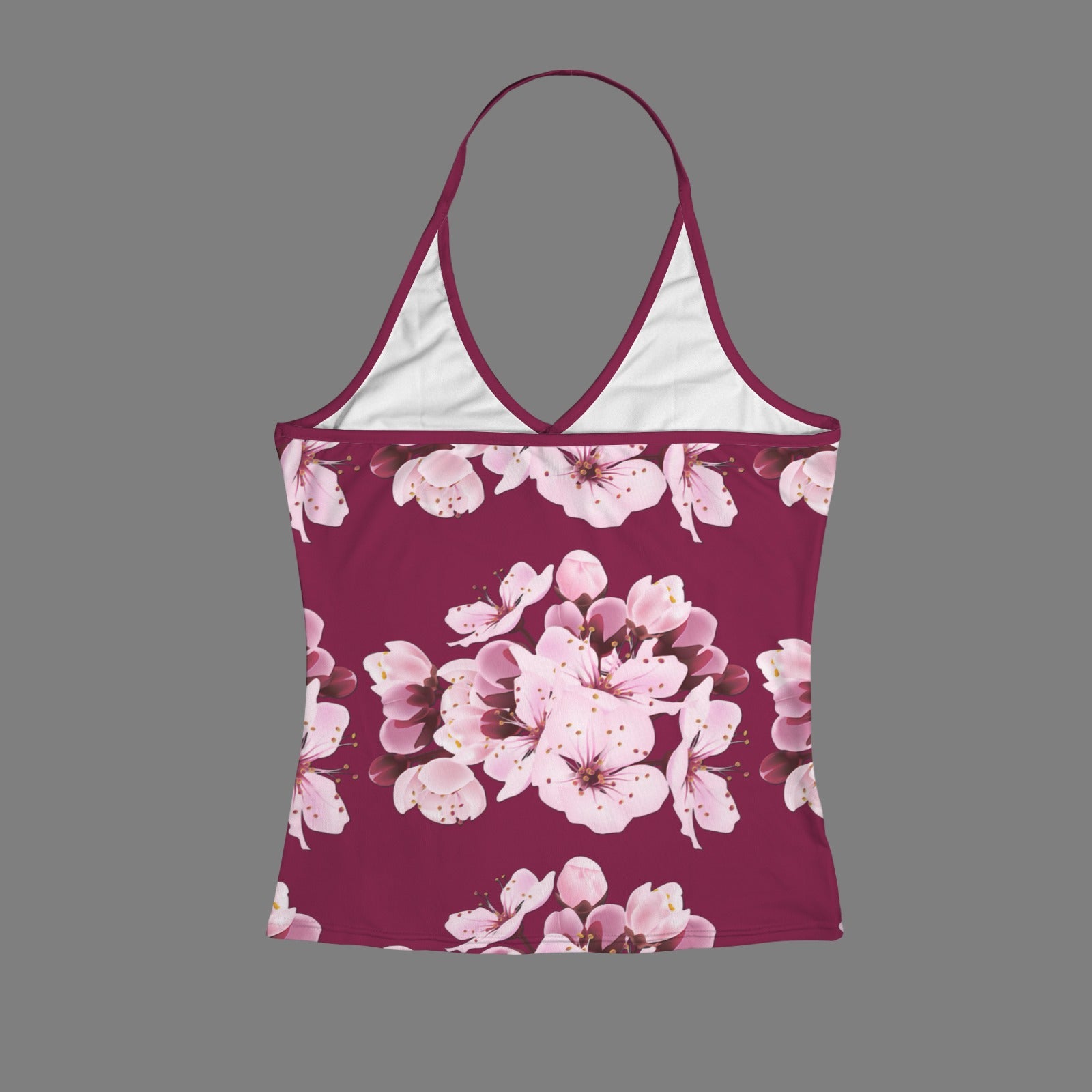 Rear flat lay view of the Sakura Symphony halter v-neck cami top showcasing the thin strap construction and vibrant pink floral print on a maroon base.