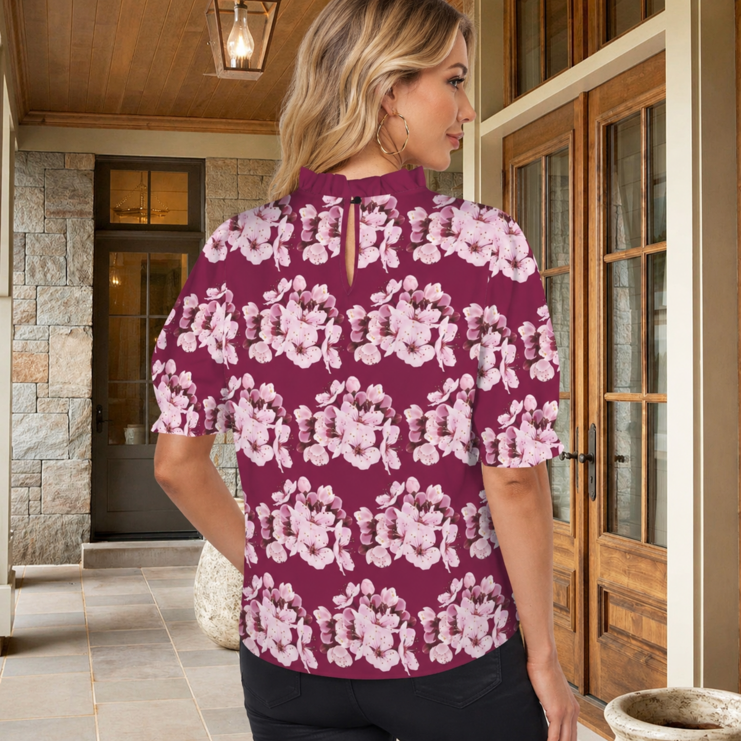 Back view of the Sakura Symphony floral blouse highlighting the mock-neck ruffle collar and elegant keyhole back closure with a button.