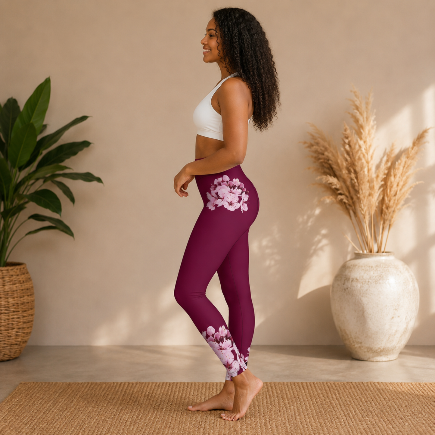 Side view of a woman showcasing the cherry blossom pattern on the hip of TRP Sakura Symphony skinny leggings.