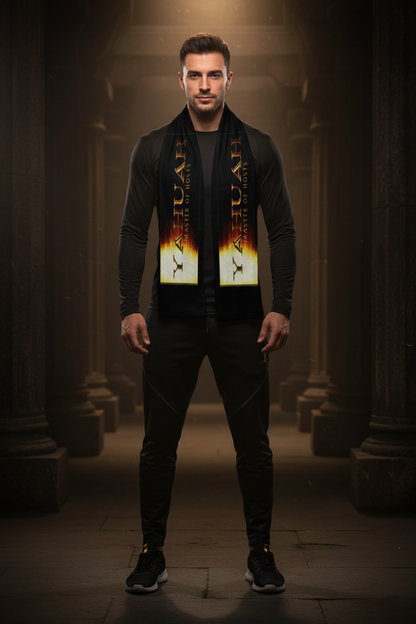 A man standing in a stone corridor wearing a black satin sports scarf featuring the gold text "Yahuah: Master of Hosts" on a fiery gradient background.