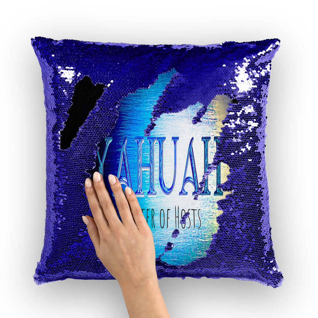 A hand brushing over a blue and purple sequin cushion to reveal the text "Yahuah Master of Hosts" against a solid black background.