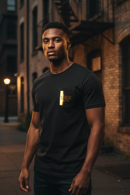 A man standing outdoors in an urban setting wearing the black Yahuah Master of Hosts unisex sublimation pocket t-shirt with a gold graphic.