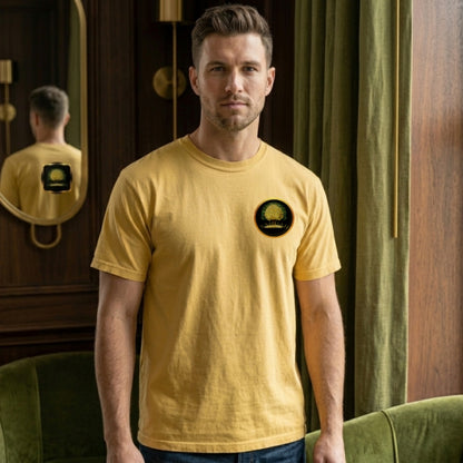 Front view of a man wearing a golden rod Yahuah: Tree of Life t-shirt with a small gold emblem on the chest.